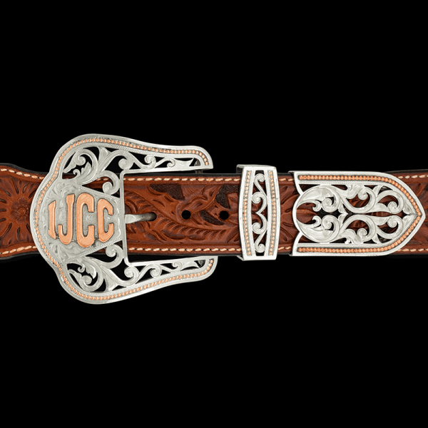 The Springville 3 Piece buckle is the perfect combination of classic western style and the new cowboy era. Featuring gorgeous silver filigree on a hand engraved base with customizable copper ranch brand, initials or figure!